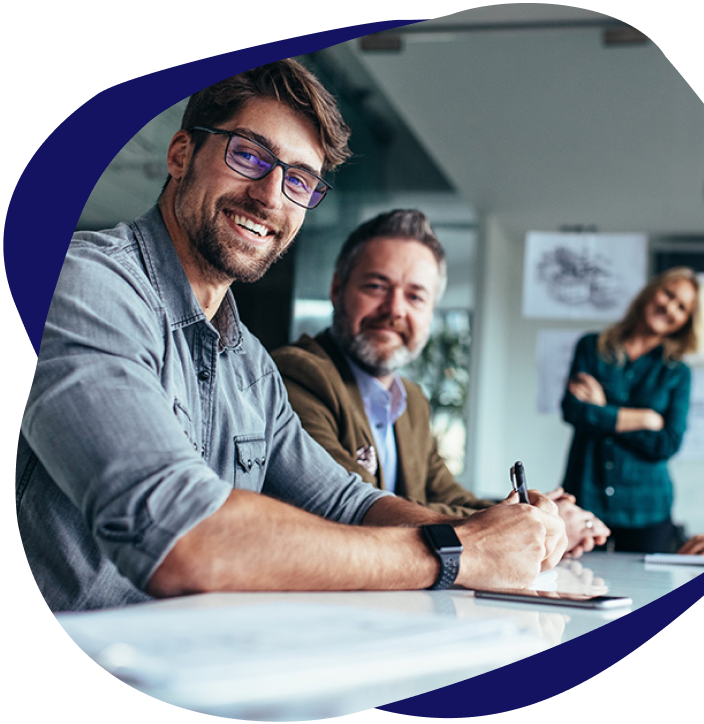 Group of people sitting in the office smiling