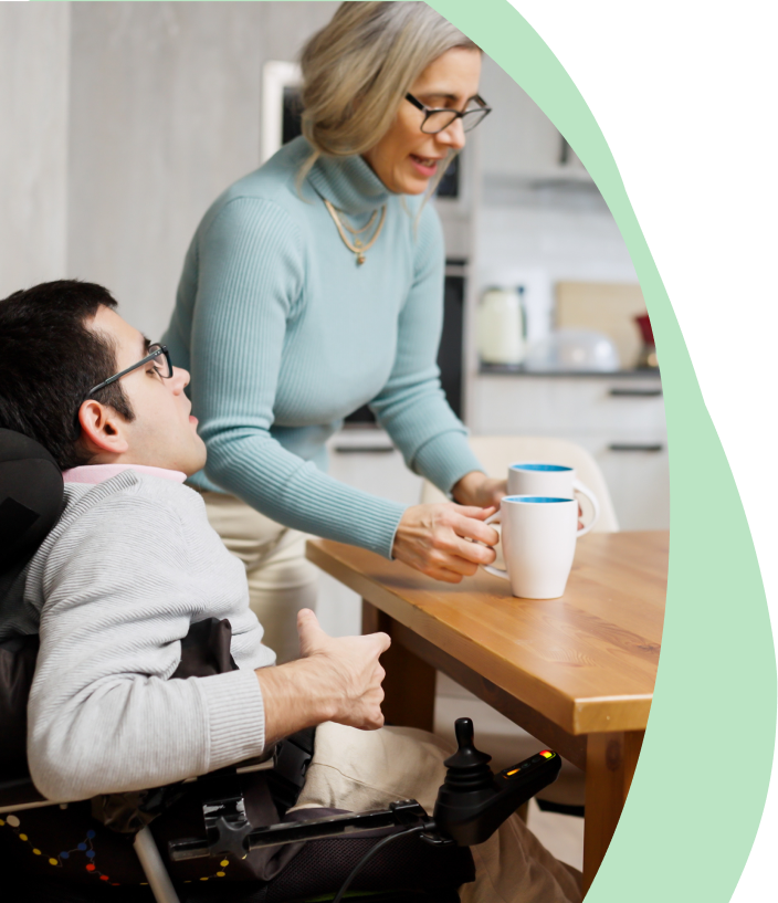 A young man with an aquired brain injury is being supported by his carer