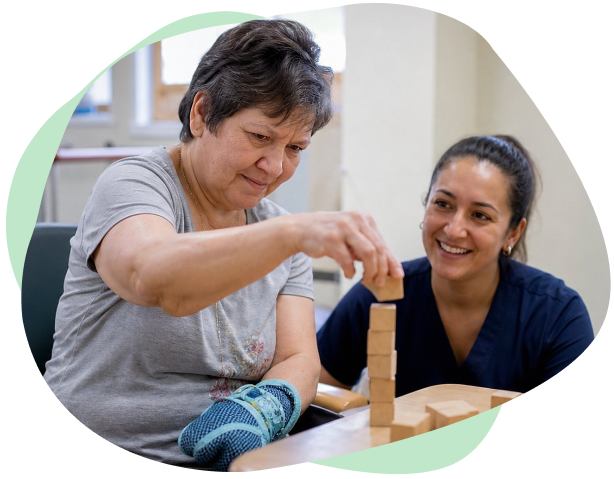 An NDIS participant who has an acquired brain injury working with a physiotherapist