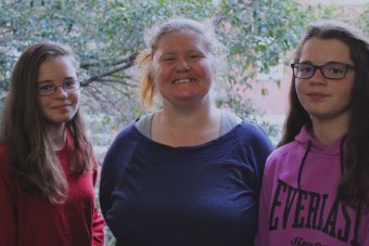  Amanda White with her twin daughters Lilly and Beth, who are 14 years old.