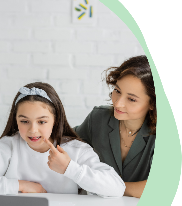 A speech therapist teaching pronunciation skills during a therapy session.