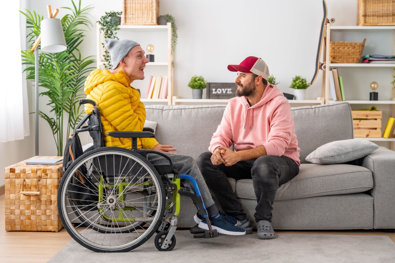 Two men seated in living room enjoying a conversation