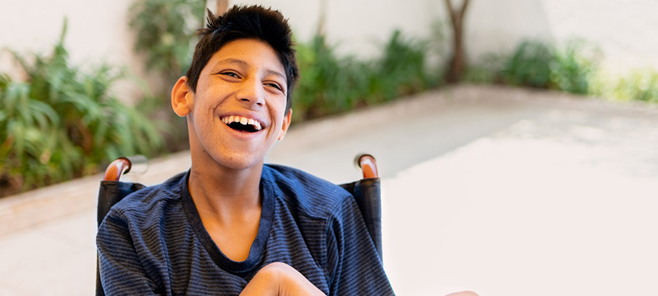 Young boy with cerebral palsy in a wheelchair