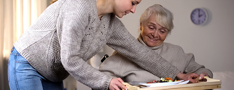 Support worker looking after an elderly person