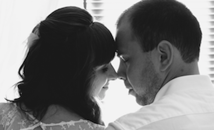 wedding photo of husband and wife loving gazing into each other's eyeswedding photo of husband and wife loving gazing into each other's eyes