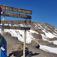 Steve standing at Stella point on Mount Kilimanjaro