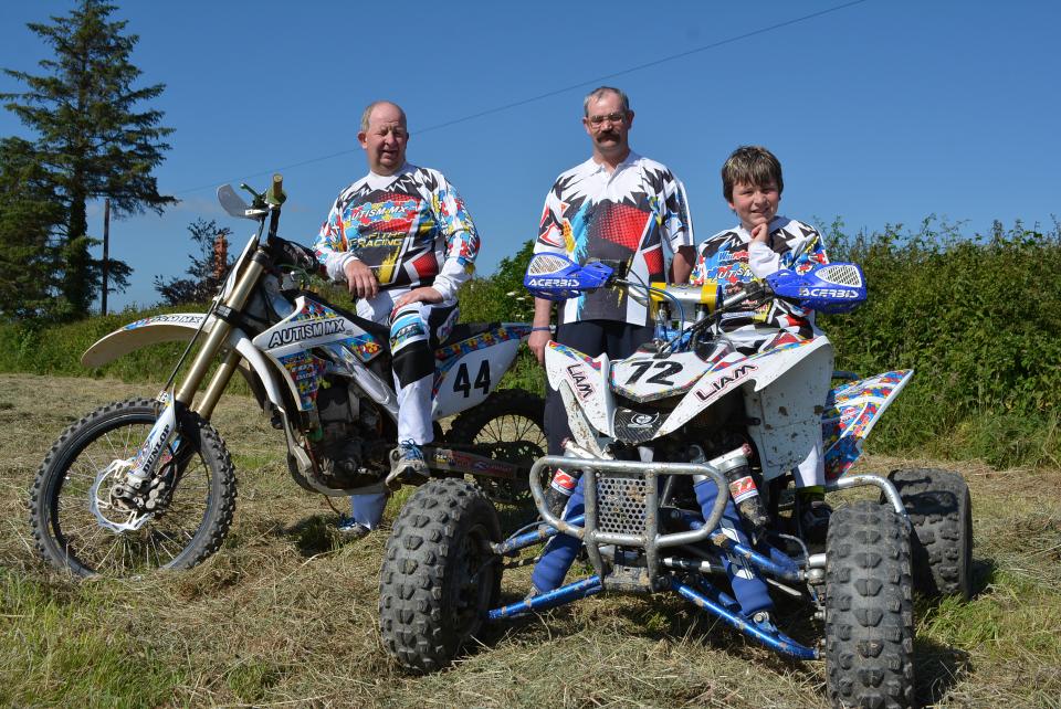 Liam sits on his quad bike smiling