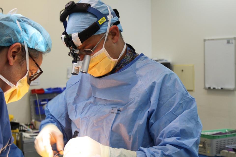 Dr. Marc Coughlan focuses on performing a surgical operation