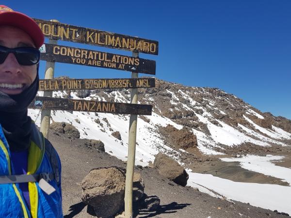 Steve standing at Stella point on Mount Kilimanjaro