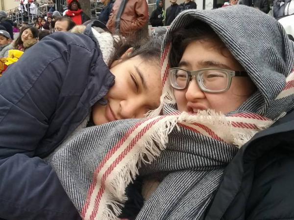 Dian with her sister hugging her