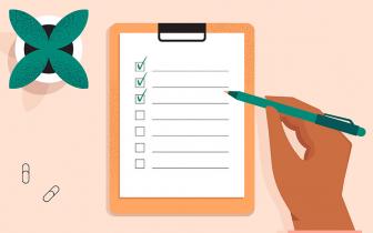 Checklist with a person holding a pen ticking off items
